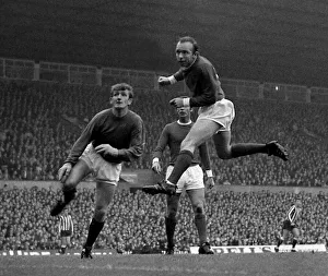 Heading Prints: Manchester Uniteds goalkeeper Alex Stepney looks on anxiously as defender Nobby