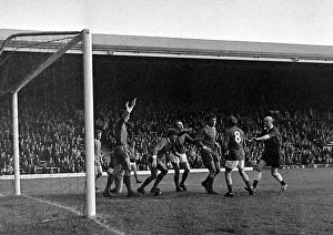 Manchester Uniteds John Fitzpatrick surrounded by angry Liverpool players after a