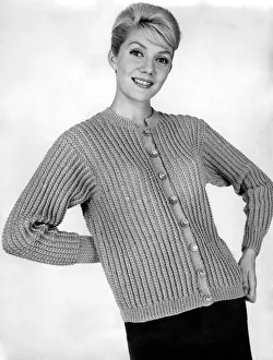 Mannequin modelling a cardigan called a Bully Beauty from New York. November 1959 P006908
