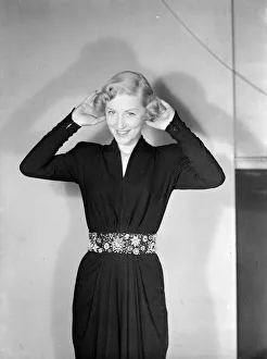 Mannequin modelling the latest 1949 fashions Alternate Caption Sorry I