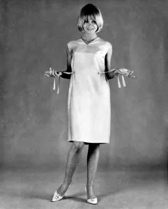 Mannequin seen here modeling a summer dress with a pull draw belt. August 1965 P007742