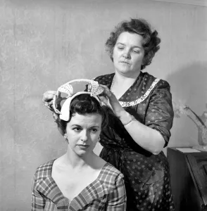 Mannequins modelling the 1956 spring / summer hat collection. April 1956