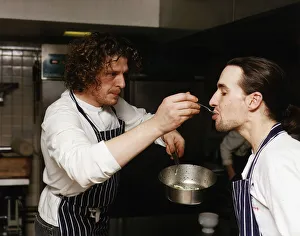 Marco Pierre White Michelin starred chef seen here in his kitchen getting a fellow chef