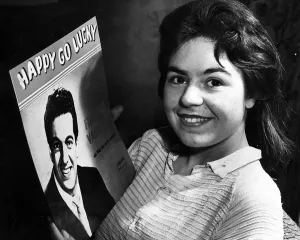 00029 Prints: Margaret Smith 16 year old jute worker October 1958 From Mid Craigie Dundee holding