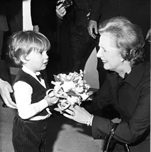 Margaret Thatcher arriving at the Three Tuns Hotel in Durham receiving a bouquet