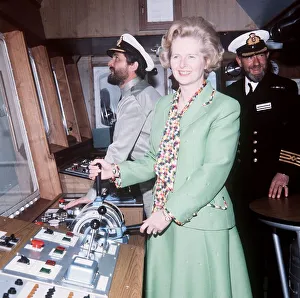 Margaret Thatcher on board Star Taurus ship green suit holding controls