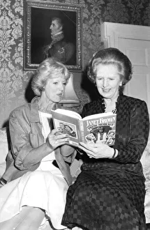 Margaret Thatcher and Janet Brown at 10 Downing Street reading Janet Brown
