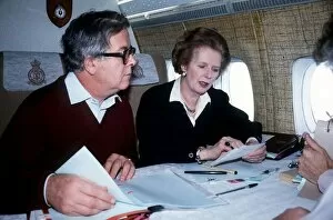 Images Dated 1st December 1984: Margaret Thatcher MP prime Minister with Geoffrey Howe MP sit on a plane on their way to