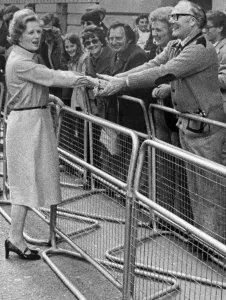 Politicians Prints: Margaret Thatcher shaking hands with fan during walkabout 08 / 05 / 1979