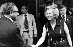 Margaret Thatcher shaking hands with Henry Kissinger outside Claridiges