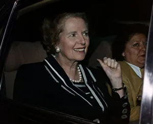 Margaret Thatcher sitting in car being Driven
