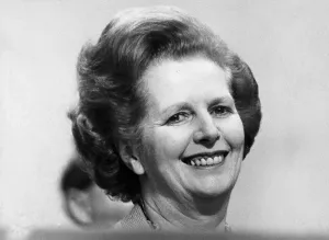 Margaret Thatcher smiling on podium at Tory party conference - October 1982