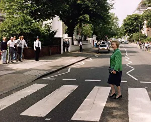 Margaret Thatcher walking across zebra crossing in Abbey Road made famous by the Beatles