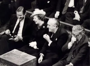 Margaret Thatcher with William Whitelaw and Sir Geoffrey Howe laughing on front bench in