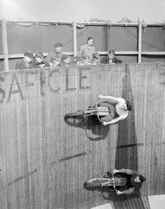 Margy Dare riding a motorbike around the Wall of Death at Morecambe in Lancashire
