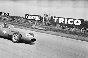 Maria Teresa de Filippis pictured in her Red Maserati 250F during the BRDC International