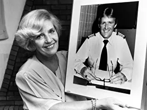Ocean Prints: Marie Duffy with a photograph of her husband John who is Hotel Manager of the QE2 which
