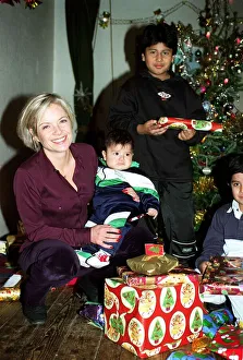 Gifts Prints: Mariella Frostrup TV Presenter / Film Critic December 1997 Handing out christmas presents