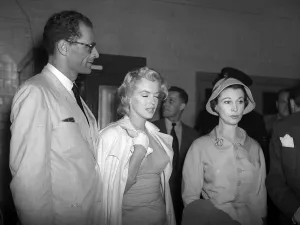 Suits And Jackets Prints: Marilyn Monroe actress with husband Arthur Miller at London Airport July 1956