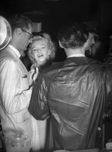 Marilyn Monroe with husband Arthur Miller at London airport, July 1956