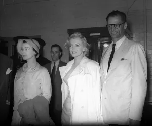Marilyn Monroe with new husband Arthur Miller and actress Vivien Leigh at press