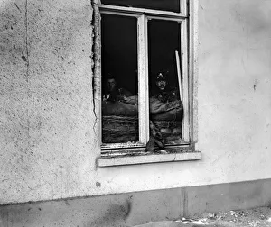 Marines of the British Naval Brigade seen here sniping at the enemy from the windows of