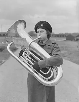 Puff Prints: Marion Perry of the WRAC ( Womens Royal Army Corps ) seen here playing the Euphonium