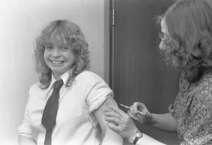 Caucasian Prints: Marion Pollock, 15, subjects herself to an injection against German measles (Rubella