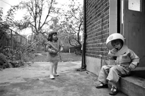 Mark Diment wearing a space-suit in the garden of Chancellor Grove House with his 18
