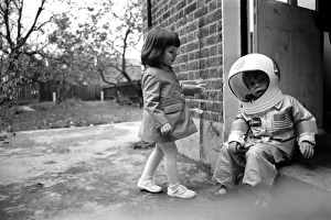 Mark Diment wearing a space-suit in the garden of Chancellor Grove House with his 18
