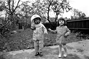 Mark Diment wearing a space-suit in the garden of Chancellor Grove House with his 18