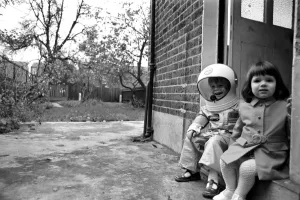 Mark Diment wearing a space-suit in the garden of Chancellor Grove House with his 18