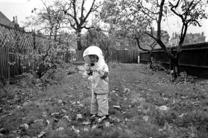 Mark Diment wearing a space-suit in the garden of Chancellor Grove House