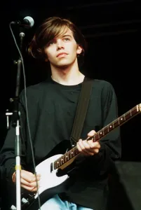 Mark Gardener singer guitarist with Ride 1990 on stage at Reading Festival
