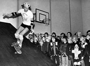 Skateboard Prints: Mark Howard demonstrates his skateboarding skill to an appreciative audience at West