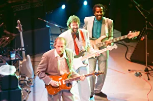 Mark Knopfler, Eric Clapton and another performer on stage at The Prince