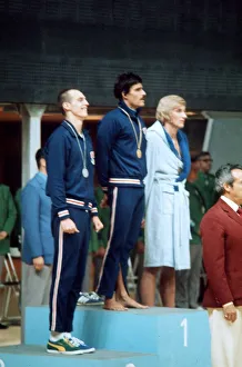 Mark Spitz swimmer 1972 Munich Olympics on rostrum receiving gold medal track suit
