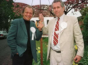 Polling Station Prints: Martin Bell shares umbrella with actor David Sole during his election campaign April