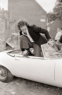 00140 Prints: Martin Shaw Jumping out of a white convertable car on the set of The Professionals