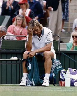 Martina Navratilova hangs her head in despair after Monica Seles had bundled her out of