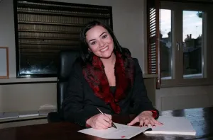 Martine McCutcheon Actress September 98 Eastenders actress sitting at desk