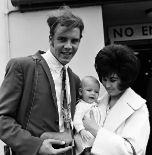 Marty Wilde at London Airport with his wife Joyce and their six month old daughter Kim