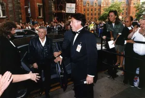 00065 Prints: Mary Kemp Staff Reporter trying to speak to Frank Sinatra as he arrives at the Royal