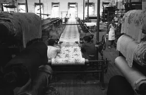 Textile Prints: Material is finished and rolled into bolts at an un-named Milan mill. Circa 1955