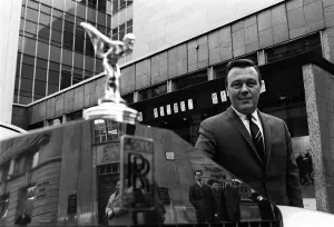 00047 Prints: Matt Monro Singer with his Rolls Royce, Mar 1966 in front of Mirror building
