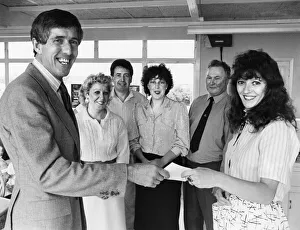 Teachers Prints: Maureen Male hands complimentary tickets to Head / Brian Wimsey watched by from left to