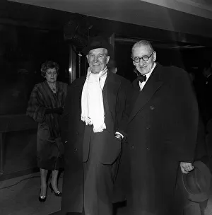 Scarves And Shawls Prints: Maurice Chevalier Actor arrives at the premiere of the new musical film GiGi