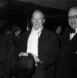 Scarves And Shawls Prints: Maurice Chevalier Actor - Feb 1959 arrives at the premiere of the new