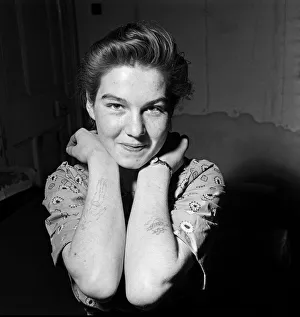 1961 Prints: Mavis Floyd, 16, shows the tattoos that make her so miserable when she goes dancing