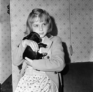 Puppy Prints: Mavis Ogden, aged 9 of Rochdale, with her new puppy - a gift from Mrs Chesworth of